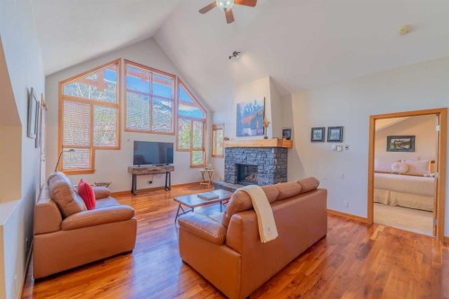 302-801 Benchlands Trail, Canmore, AB - Indoor Photo Showing Living Room With Fireplace