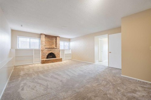 128 Silver Ridge, Calgary, AB - Indoor With Fireplace
