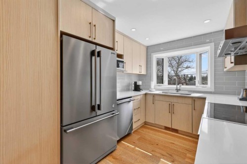 12 Glacier Drive Sw, Calgary, AB - Indoor Photo Showing Kitchen With Upgraded Kitchen