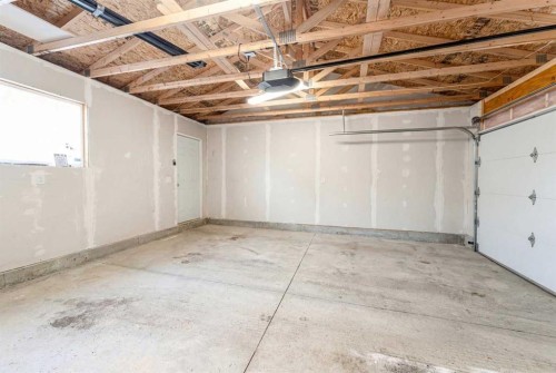 318 Masters Row Se, Calgary, AB - Indoor Photo Showing Garage