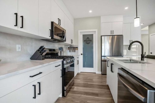 1073 Waterford Drive, Chestermere, AB - Indoor Photo Showing Kitchen With Stainless Steel Kitchen With Double Sink With Upgraded Kitchen