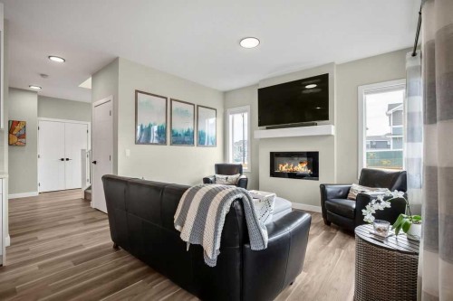 1073 Waterford Drive, Chestermere, AB - Indoor Photo Showing Living Room With Fireplace