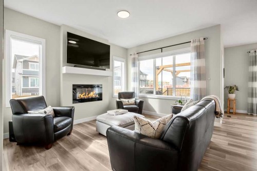 1073 Waterford Drive, Chestermere, AB - Indoor Photo Showing Living Room With Fireplace