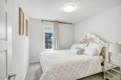 408-474 Seton Circle Se, Calgary, AB - Indoor Photo Showing Bedroom