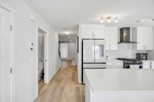 408-474 Seton Circle Se, Calgary, AB - Indoor Photo Showing Kitchen With Upgraded Kitchen
