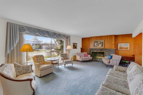 4720 Coronation Drive Sw, Calgary, AB - Indoor Photo Showing Living Room With Fireplace