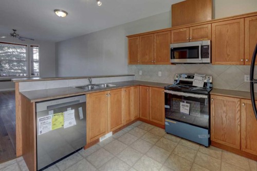 302-2006 Luxstone Boulevard Sw, Airdrie, AB - Indoor Photo Showing Kitchen With Double Sink