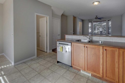 302-2006 Luxstone Boulevard Sw, Airdrie, AB - Indoor Photo Showing Kitchen With Double Sink