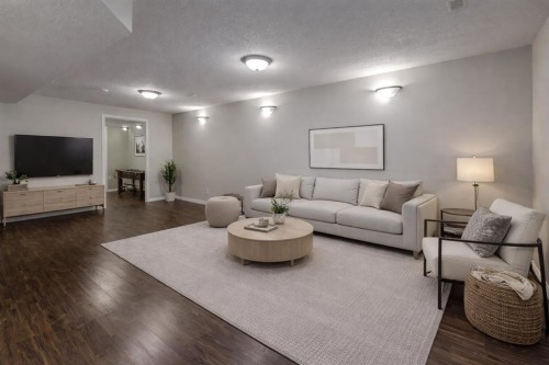 302-2006 Luxstone Boulevard Sw, Airdrie, AB - Indoor Photo Showing Living Room