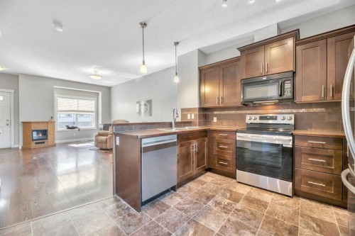 238 Ranch Ridge Meadow, Strathmore, AB - Indoor Photo Showing Kitchen With Stainless Steel Kitchen