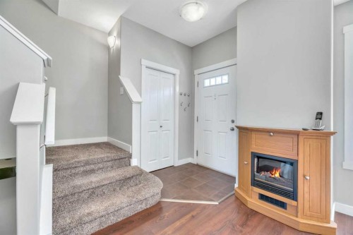 238 Ranch Ridge Meadow, Strathmore, AB - Indoor Photo Showing Other Room With Fireplace
