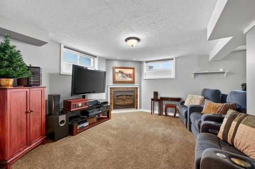 2023 Glenwood Drive Sw, Calgary, AB - Indoor With Fireplace