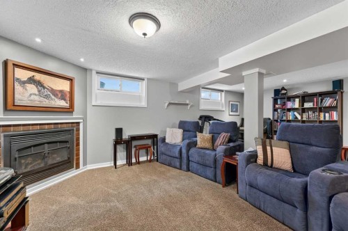 2023 Glenwood Drive Sw, Calgary, AB - Indoor Photo Showing Living Room With Fireplace