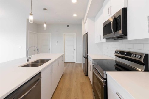 5403-20295 Seton Way Se, Calgary, AB - Indoor Photo Showing Kitchen With Stainless Steel Kitchen With Double Sink With Upgraded Kitchen