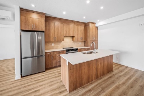 206-10 Cascade Ridge, Canmore, AB - Indoor Photo Showing Kitchen With Double Sink With Upgraded Kitchen