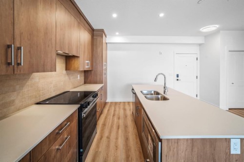 206-10 Cascade Ridge, Canmore, AB - Indoor Photo Showing Kitchen With Double Sink