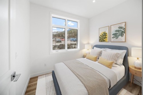 104-10 Cascade Ridge, Canmore, AB - Indoor Photo Showing Bedroom