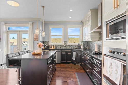 409 Kinniburgh Boulevard, Chestermere, AB - Indoor Photo Showing Kitchen With Stainless Steel Kitchen With Upgraded Kitchen