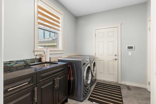 409 Kinniburgh Boulevard, Chestermere, AB - Indoor Photo Showing Laundry Room
