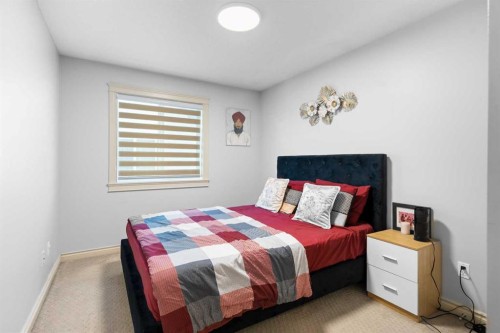 409 Kinniburgh Boulevard, Chestermere, AB - Indoor Photo Showing Bedroom