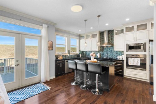 409 Kinniburgh Boulevard, Chestermere, AB - Indoor Photo Showing Kitchen With Upgraded Kitchen