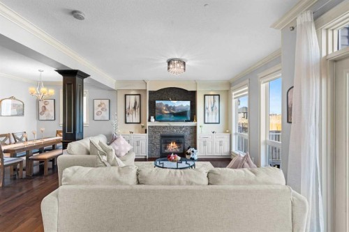 409 Kinniburgh Boulevard, Chestermere, AB - Indoor Photo Showing Living Room With Fireplace