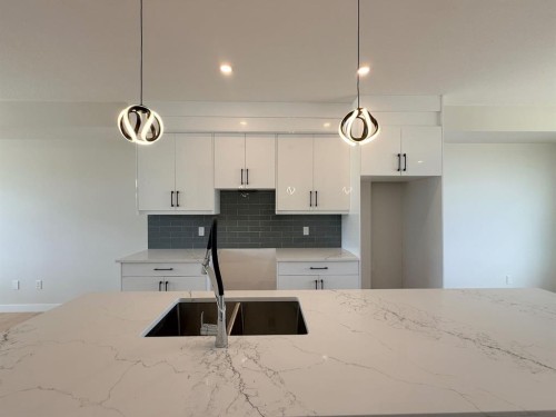 1927 Mccaskill Drive, Crossfield, AB - Indoor Photo Showing Kitchen With Double Sink