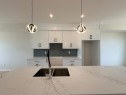 1927 Mccaskill Drive, Crossfield, AB  - Indoor Photo Showing Kitchen With Double Sink 