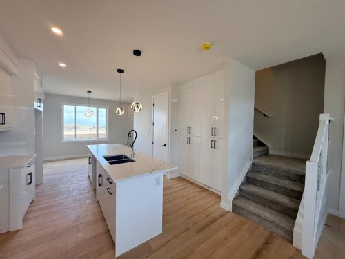 1927 Mccaskill Drive, Crossfield, AB - Indoor Photo Showing Kitchen With Double Sink With Upgraded Kitchen