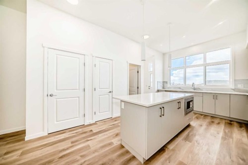 1078 Sawgrass Link Nw, Airdrie, AB - Indoor Photo Showing Kitchen With Upgraded Kitchen