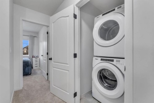 128 Seton Villas Se, Calgary, AB - Indoor Photo Showing Laundry Room