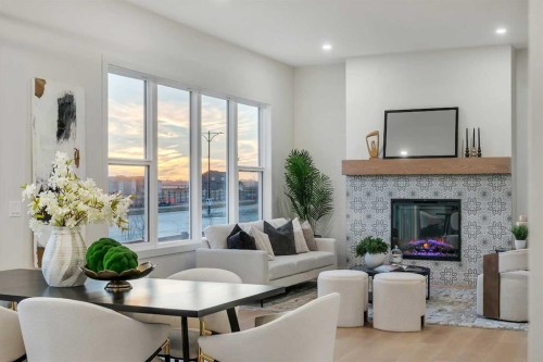 341 Limestone Bay, Balzac, AB - Indoor Photo Showing Living Room With Fireplace