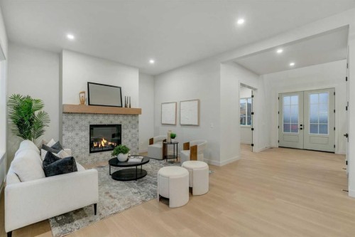 341 Limestone Bay, Balzac, AB - Indoor Photo Showing Other Room With Fireplace