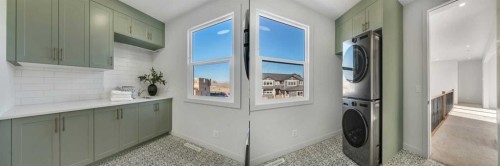 341 Limestone Bay, Balzac, AB - Indoor Photo Showing Laundry Room