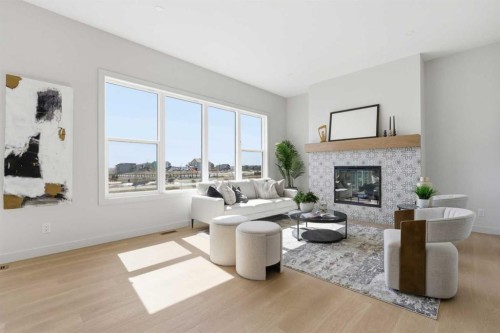 341 Limestone Bay, Balzac, AB - Indoor Photo Showing Living Room With Fireplace