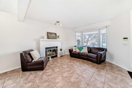 11 Martinridge Place Ne, Calgary, AB - Indoor Photo Showing Living Room With Fireplace