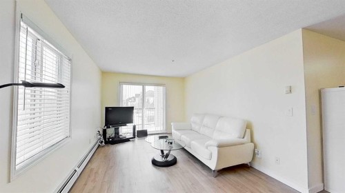 1202-2395 Eversyde Avenue Sw, Calgary, AB - Indoor Photo Showing Living Room