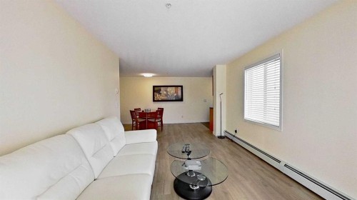 1202-2395 Eversyde Avenue Sw, Calgary, AB - Indoor Photo Showing Living Room