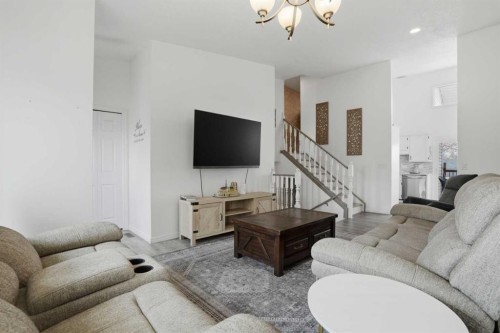 203 Shawglen Road Sw, Calgary, AB - Indoor Photo Showing Living Room