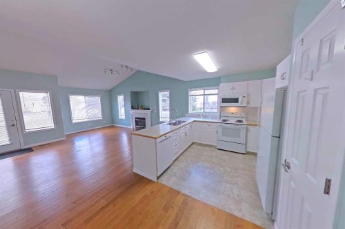 218 Centre Avenue West, Airdrie, AB - Indoor With Fireplace