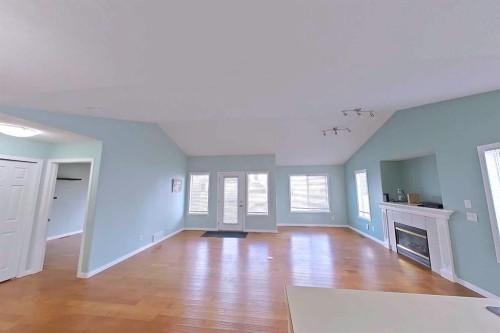 218 Centre Avenue West, Airdrie, AB - Indoor Photo Showing Other Room With Fireplace