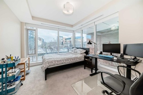 554 Riverfront Lane Se, Calgary, AB - Indoor Photo Showing Bedroom
