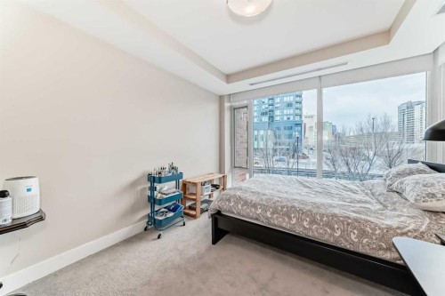 554 Riverfront Lane Se, Calgary, AB - Indoor Photo Showing Bedroom