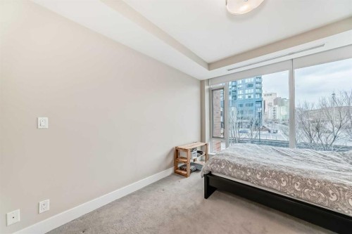 554 Riverfront Lane Se, Calgary, AB - Indoor Photo Showing Bedroom