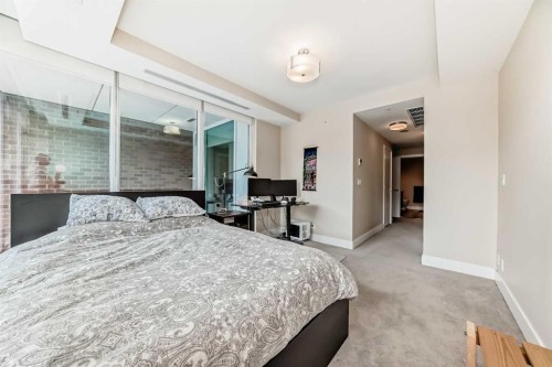 554 Riverfront Lane Se, Calgary, AB - Indoor Photo Showing Bedroom