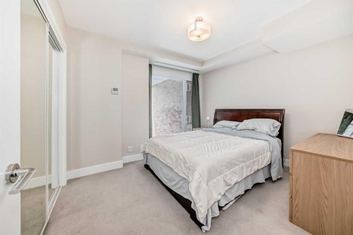 554 Riverfront Lane Se, Calgary, AB - Indoor Photo Showing Bedroom