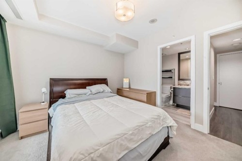 554 Riverfront Lane Se, Calgary, AB - Indoor Photo Showing Bedroom