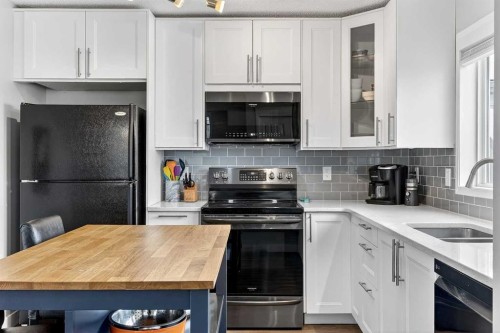 586 Evermeadow Road Sw, Calgary, AB - Indoor Photo Showing Kitchen With Double Sink