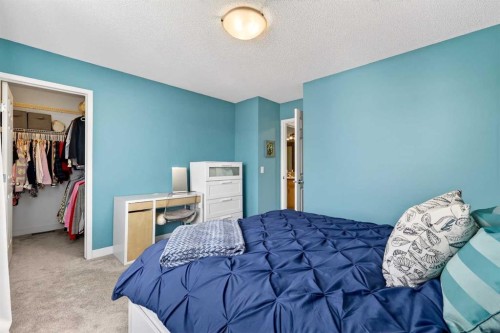 586 Evermeadow Road Sw, Calgary, AB - Indoor Photo Showing Bedroom