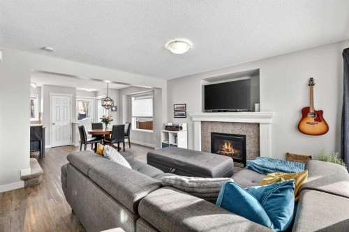 586 Evermeadow Road Sw, Calgary, AB - Indoor Photo Showing Living Room With Fireplace